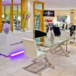 Crossly Glass Top Rectangular Dining Table in our Showroom