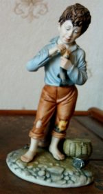 Boy with Fish Porcelain Figurine