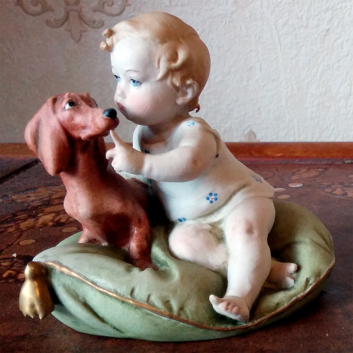 Child with Dog on Cushion Porcelain Figurine
