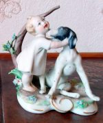 Happy Child playing with the Dog Porcelain Figurine