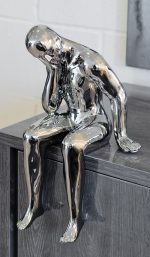 Ceramic thinking man sculpture in our showroom