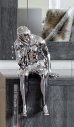 Ceramic thinking man sculpture in our showroom face on