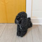 Black Poodle Door Stop Plush in our Showroom