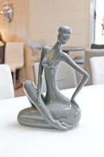 ceramic grey sitting lady in our showroom