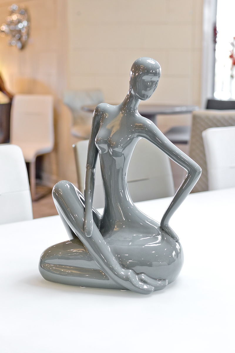 ceramic grey sitting lady in our showroom