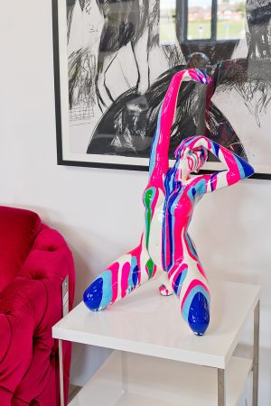 Pink and Blue Yoga Lady Sculpture in our Showroom