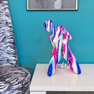 Pink and Blue Yoga Lady Kneeling Sculpture in our Showroom