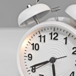 Small Light Up White Alarm Clock Close Up