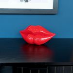 Large Red Lips Sculpture on Display
