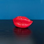 Small Red Lips Sculpture on Display