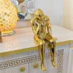 Ceramic Gold Thinking Man sitting on the Sideboard