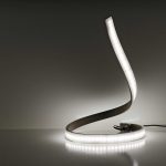 LED Snake Table Lamp on display in a dark room